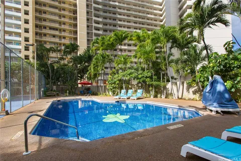 a view of a swimming pool with a patio