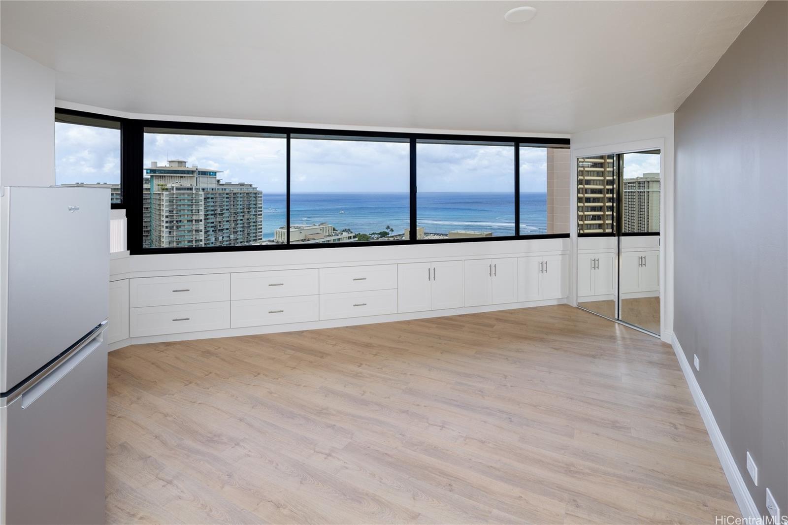 1700 Ala Moana Boulevard, Unit 3104 Honolulu, HI 96815 - Photo 3 of 15 a view of an empty room with a window