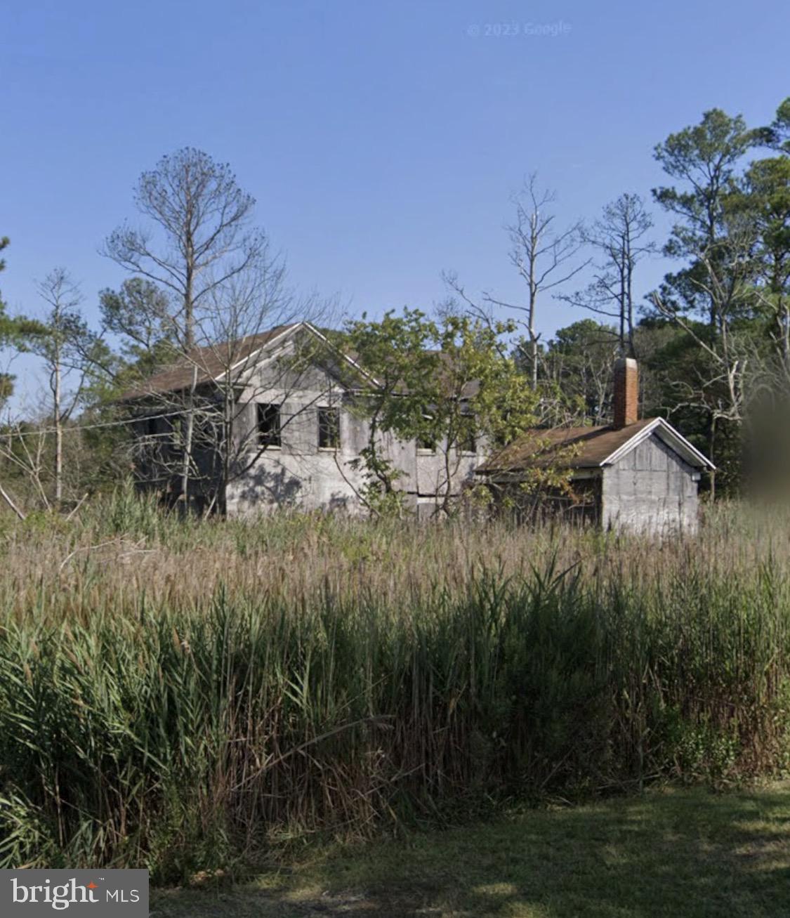 3033 William Maddox Road Crisfield, MD 21817 - Photo 1 of 1 a view of a lake with a house in background