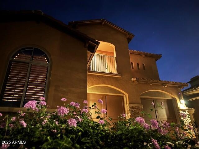 3981 East Navigator Lane Phoenix, AZ 85050 - Photo 1 of 36 a view of a house with a flower garden