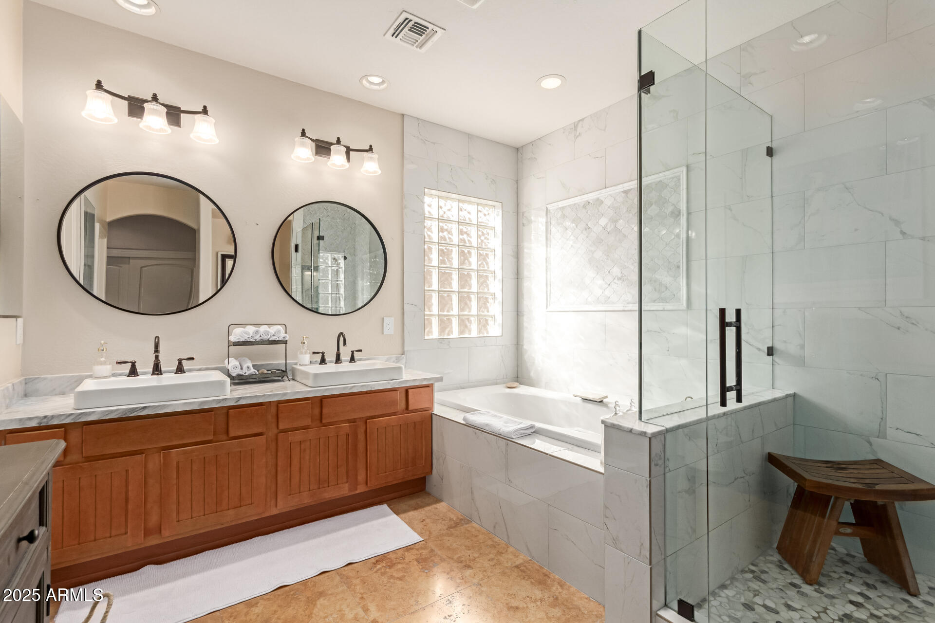 3981 East Navigator Lane Phoenix, AZ 85050 - Photo 12 of 36 a bathroom with a double vanity sink and a mirror