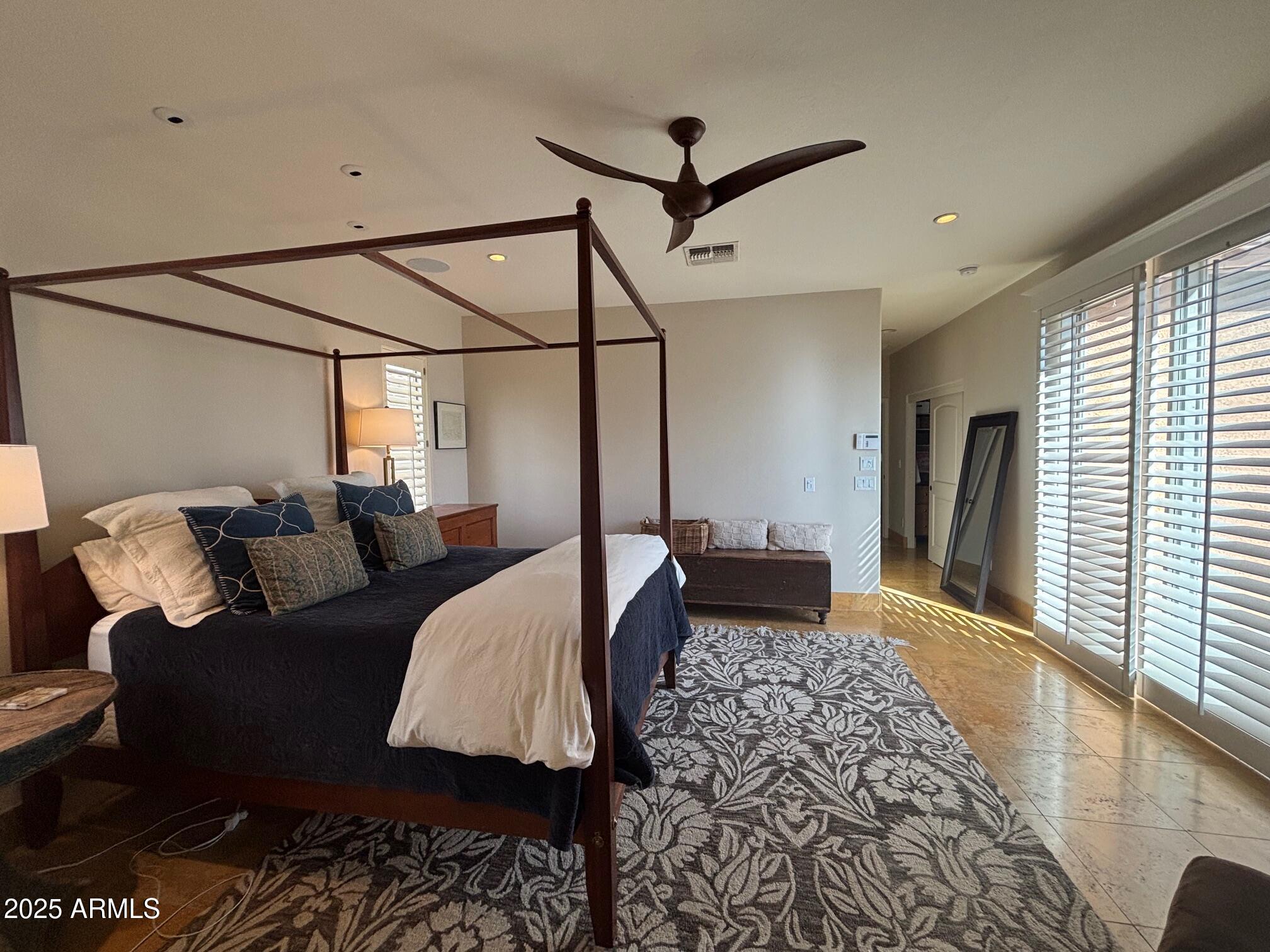 3981 East Navigator Lane Phoenix, AZ 85050 - Photo 14 of 36 a bedroom with furniture and a rug