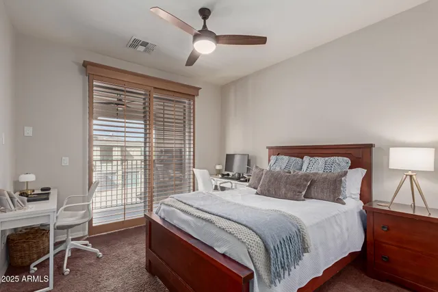 a lobby with furniture and floor to ceiling window