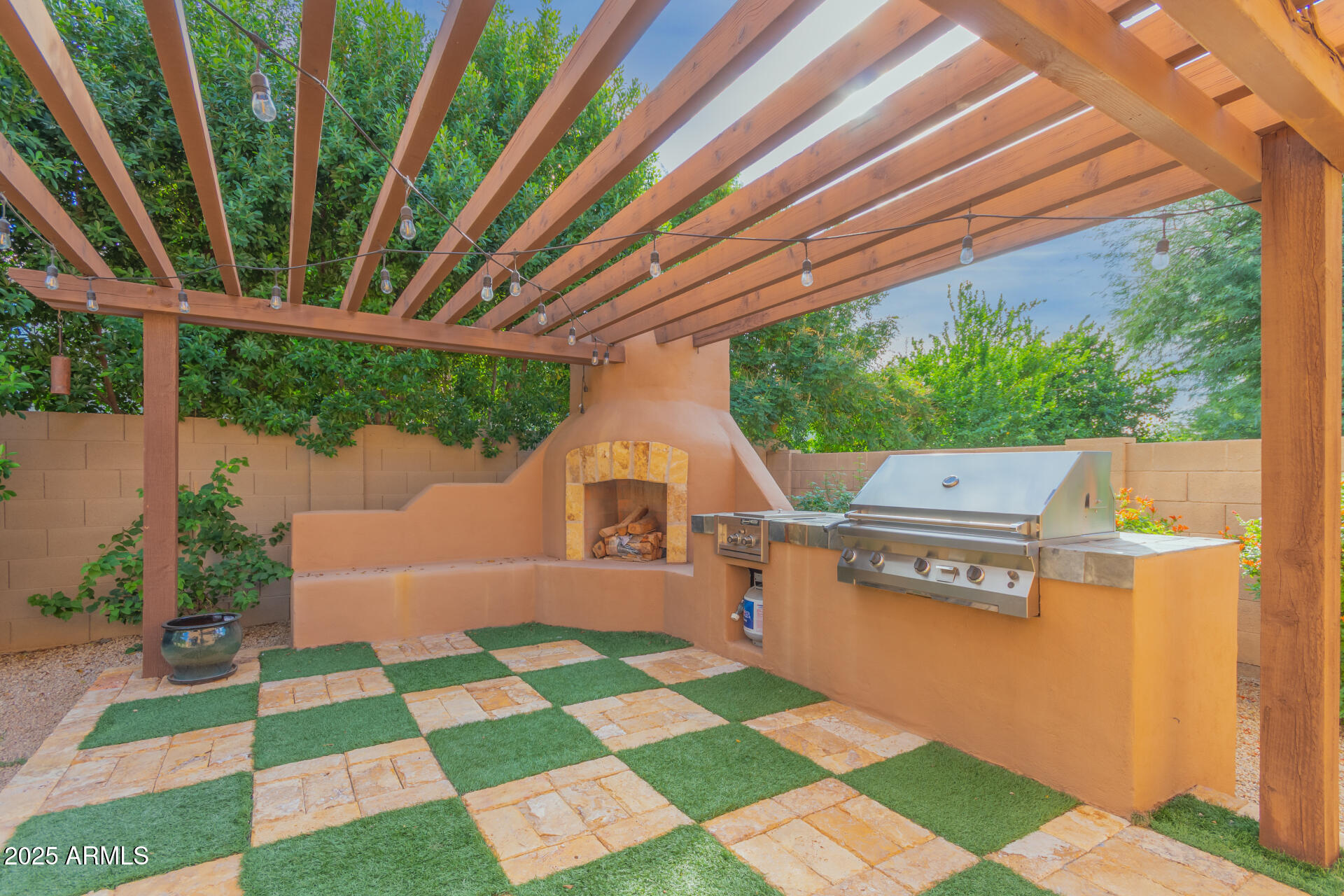3981 East Navigator Lane Phoenix, AZ 85050 - Photo 20 of 36 a view of a backyard with a garden and outdoor seating