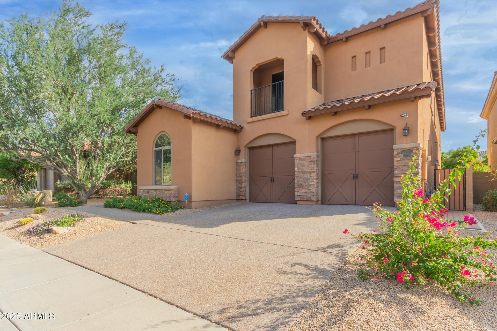 3981 East Navigator Lane Phoenix, AZ 85050 - Photo 2 of 36 a front view of a house with a yard and garage