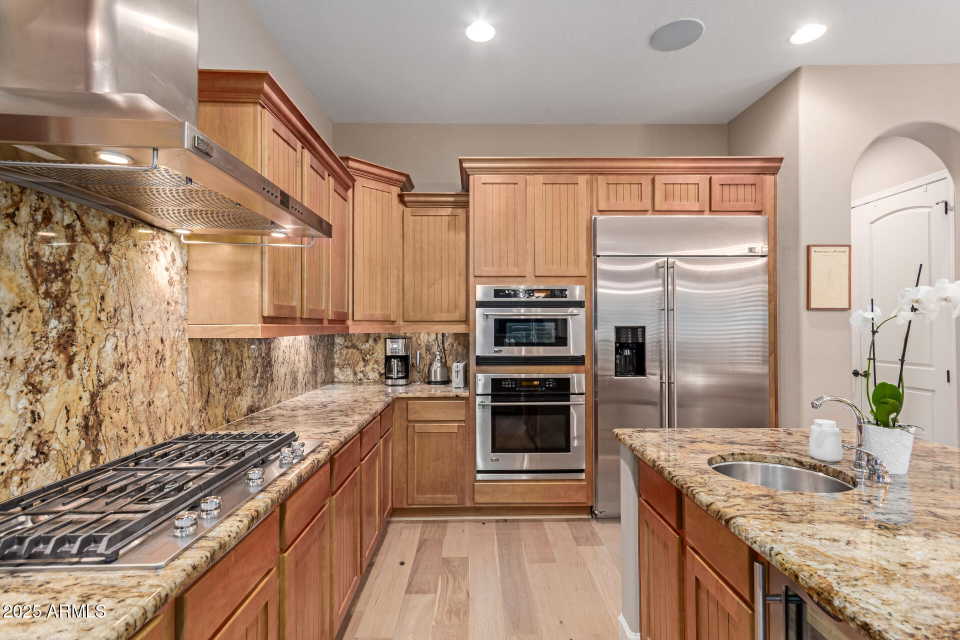 3981 East Navigator Lane Phoenix, AZ 85050 - Photo 8 of 36 a kitchen with a stove a sink and a refrigerator