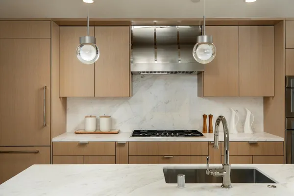 a kitchen with a cabinets and chandelier