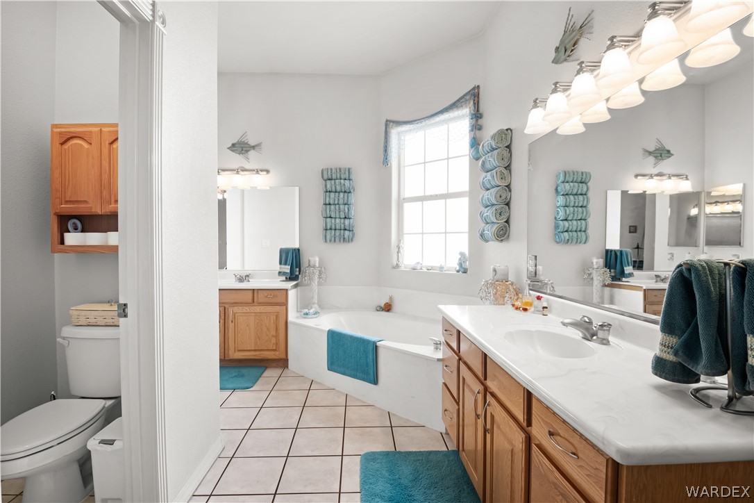 2898 Mountain Trail Road Kingman, AZ 86401 - Photo 18 of 75 a bathroom with a sink a vanity and a mirror