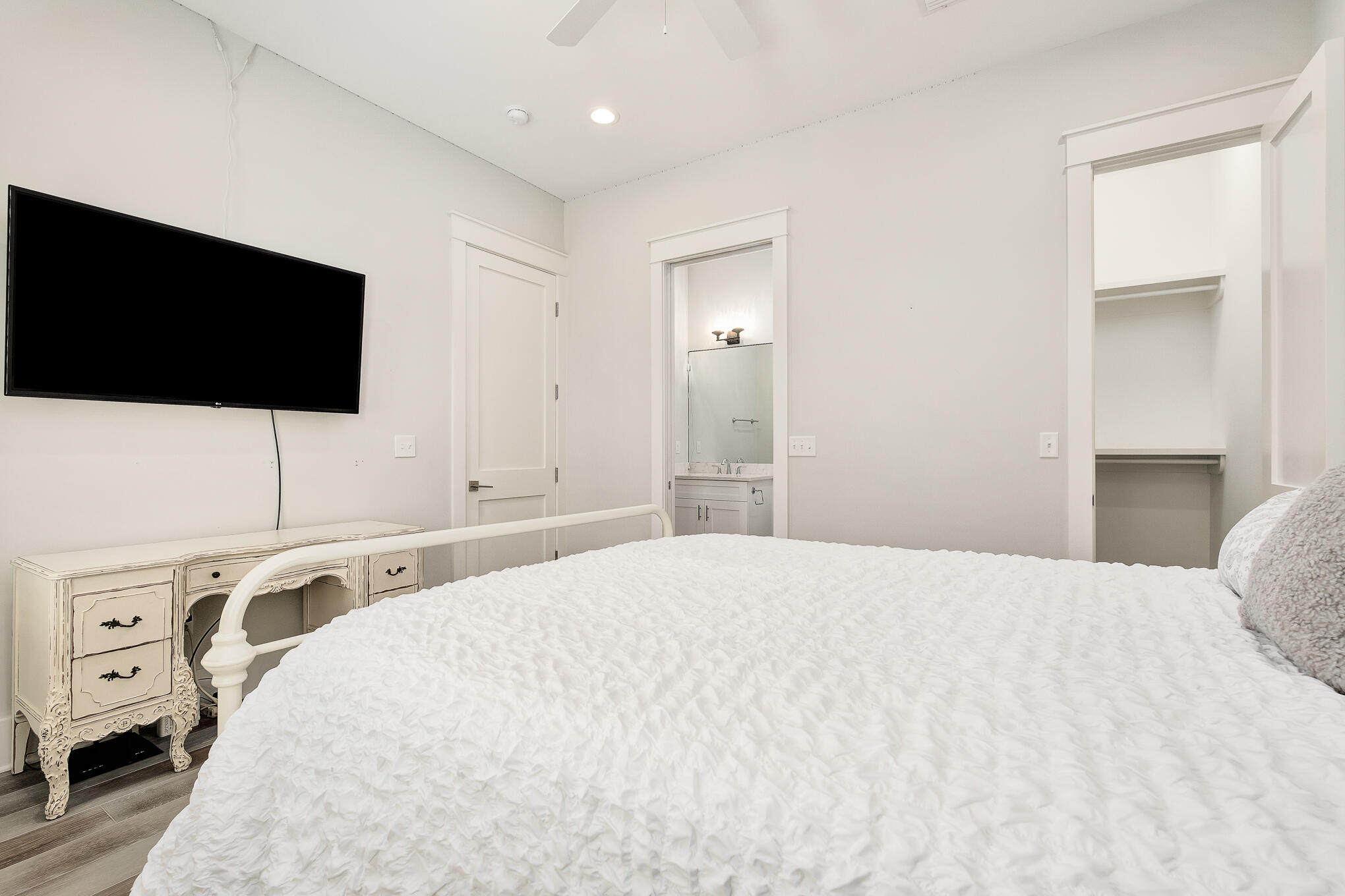 126 Crescent Road Santa Rosa Beach, FL 32459 - Photo 14 of 46 a bedroom with a bed and a flat screen tv