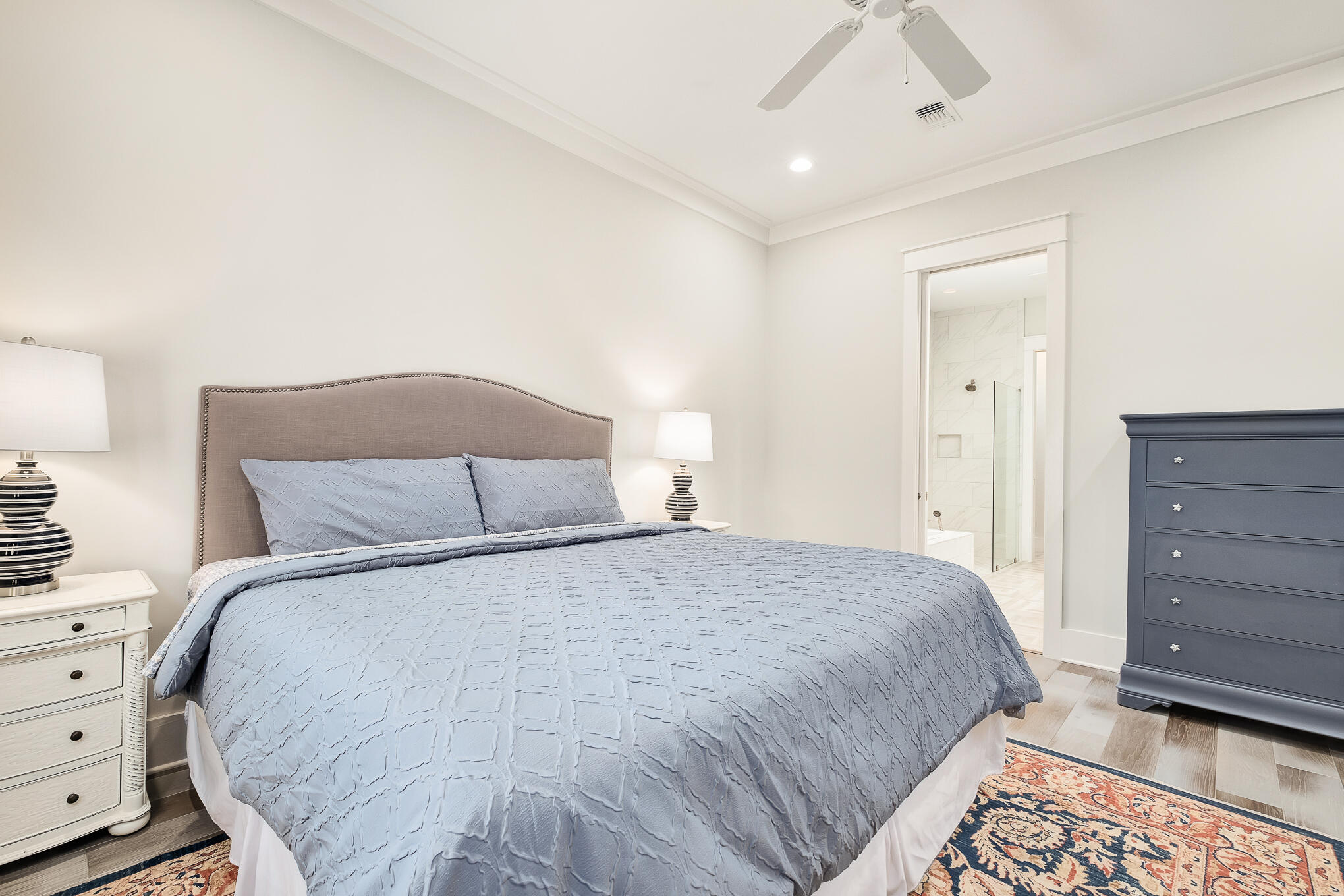 126 Crescent Road Santa Rosa Beach, FL 32459 - Photo 9 of 46 a large bed sitting in a bedroom and dresser