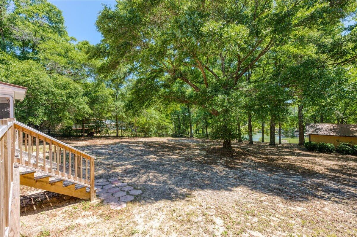 210 Shell Drive Crestview, FL 32536 - Photo 60 of 67 a view of a yard with large trees