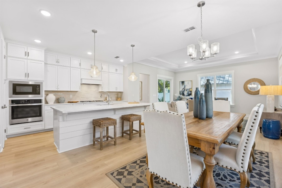 649 South 7th Street Fernandina Beach, FL 32034 - Photo 11 of 35 a large kitchen with a table and chairs