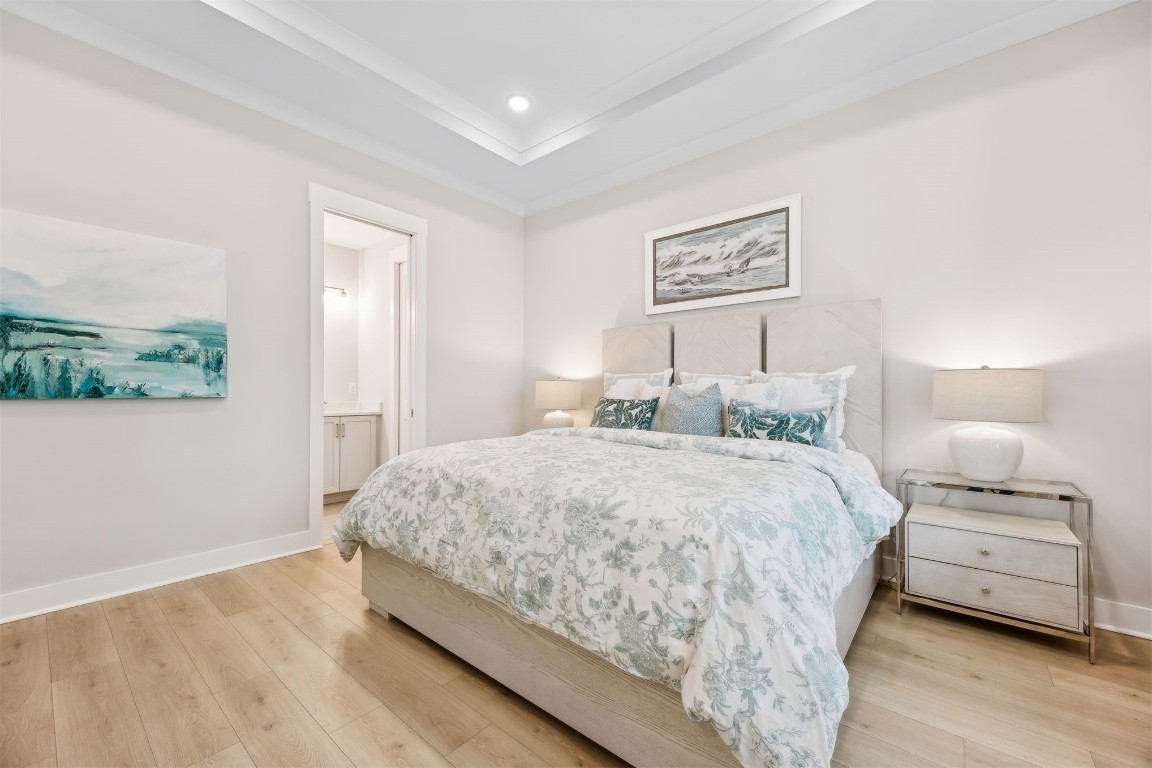 649 South 7th Street Fernandina Beach, FL 32034 - Photo 17 of 35 a bedroom with a bed and a night stand