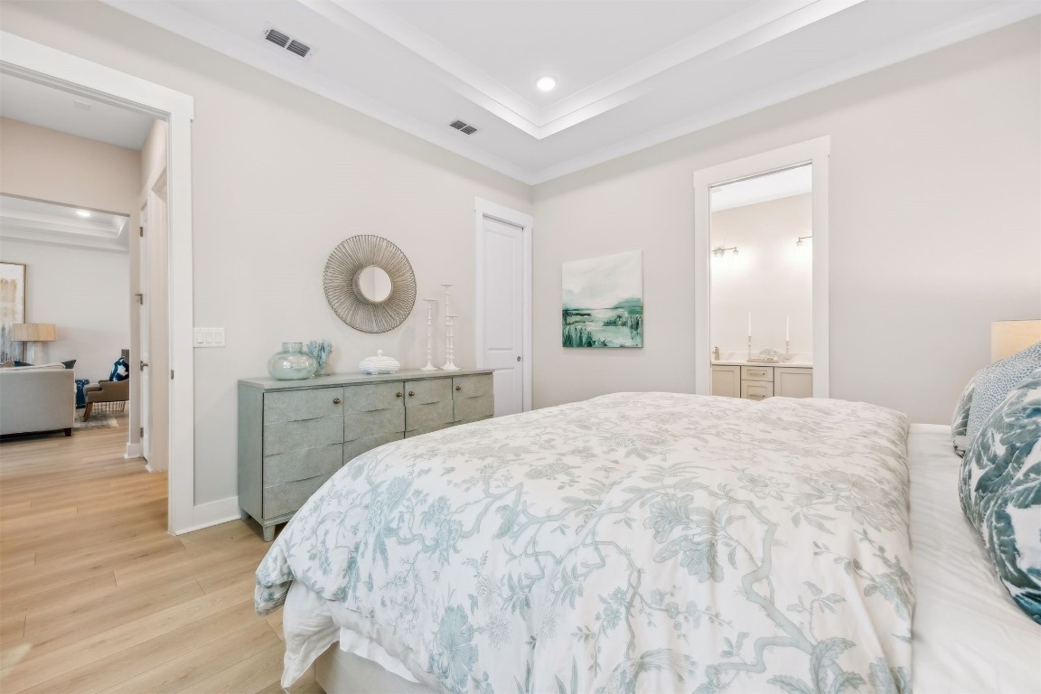 649 South 7th Street Fernandina Beach, FL 32034 - Photo 18 of 35 a spacious bedroom with a bed and a cabinets