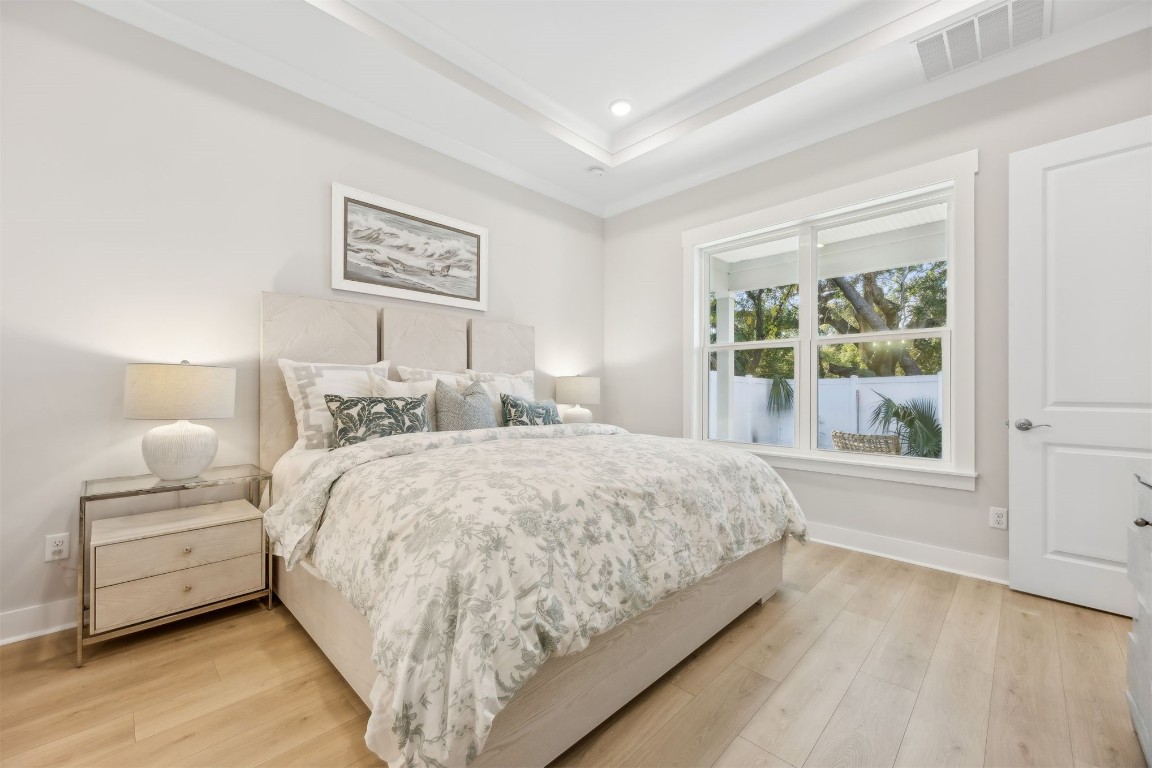 649 South 7th Street Fernandina Beach, FL 32034 - Photo 19 of 35 a bedroom with a large bed and a window