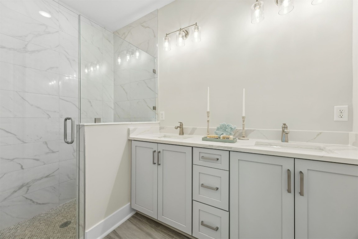 649 South 7th Street Fernandina Beach, FL 32034 - Photo 20 of 35 a bathroom with double sink and a mirror