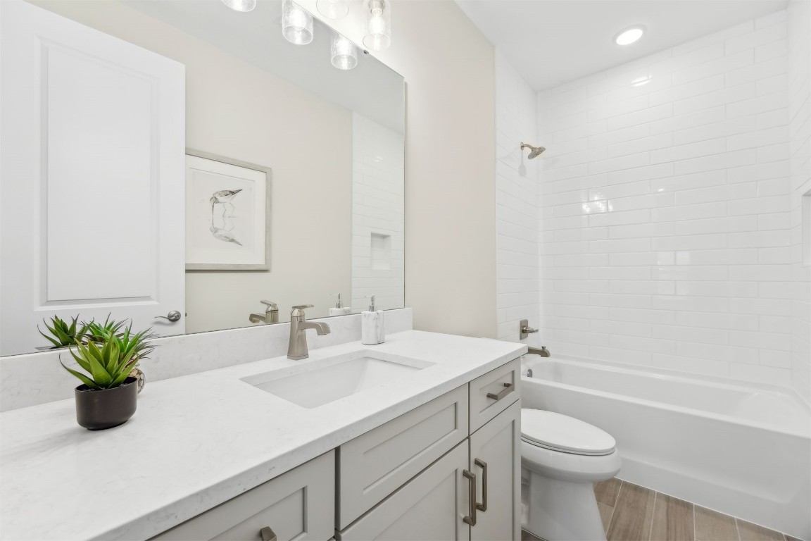 649 South 7th Street Fernandina Beach, FL 32034 - Photo 24 of 35 a bathroom with a sink a toilet and a mirror