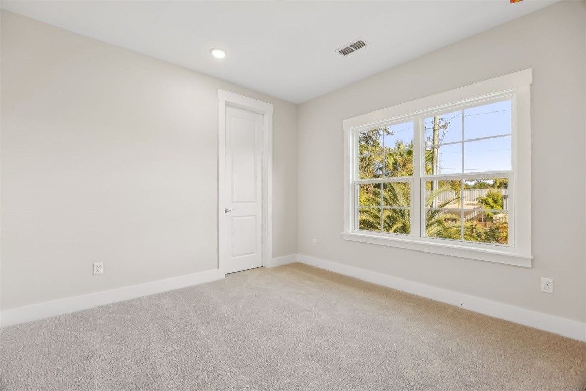 649 South 7th Street Fernandina Beach, FL 32034 - Photo 25 of 35 an empty room with windows