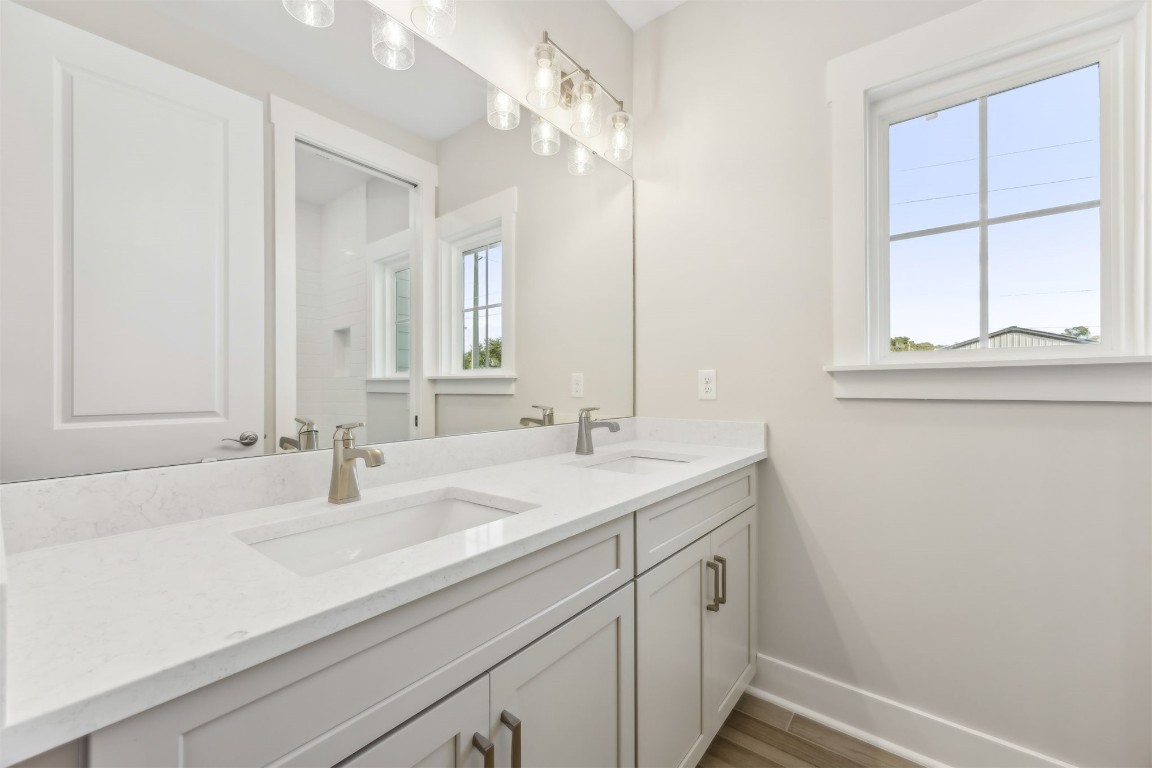 649 South 7th Street Fernandina Beach, FL 32034 - Photo 27 of 35 a bathroom with a sink and a mirror