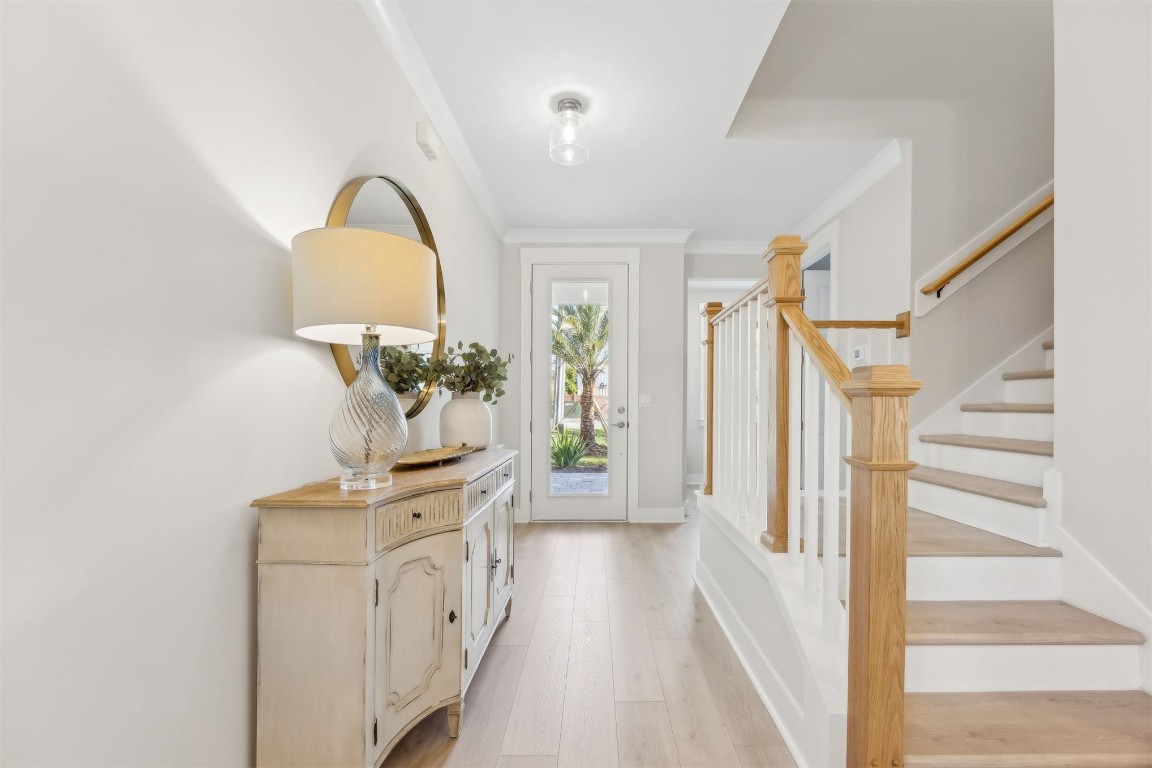 649 South 7th Street Fernandina Beach, FL 32034 - Photo 6 of 35 a view of a kitchen with a sink wooden floor and staircase