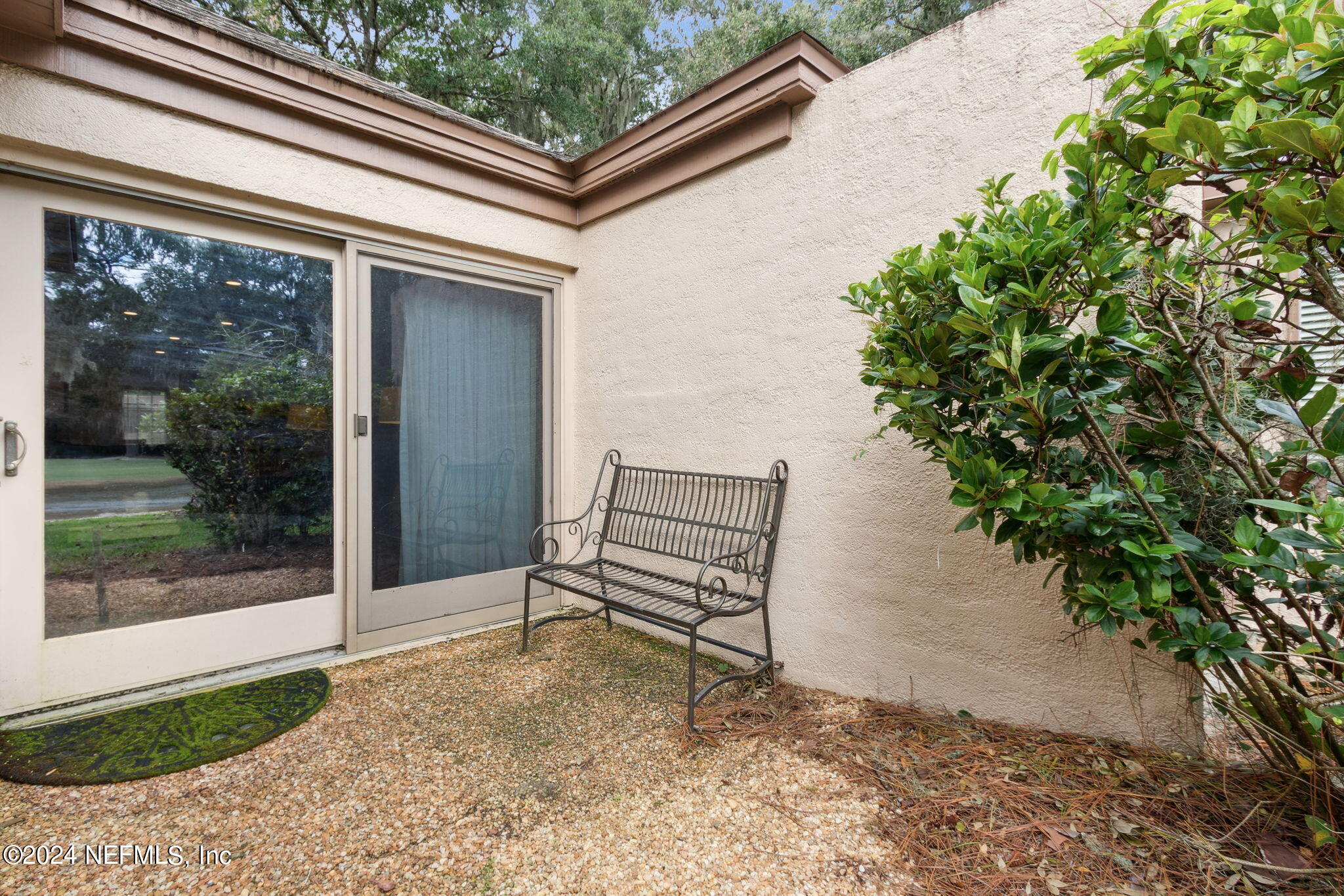 3327 Sea Marsh Road Fernandina Beach, FL 32034 - Photo 24 of 39 a view of a bench in the backyard