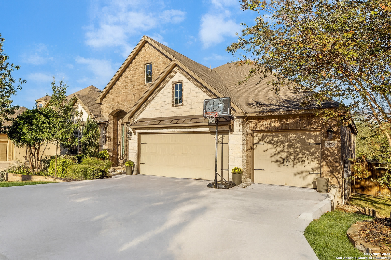 28938 Fairs Gate Fair Oaks Ranch, TX 78015 - Photo 2 of 41 a view of a house with a yard and garage