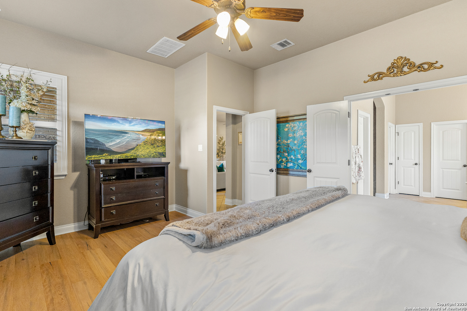 28938 Fairs Gate Fair Oaks Ranch, TX 78015 - Photo 27 of 41 a bedroom with a bed and a chandelier