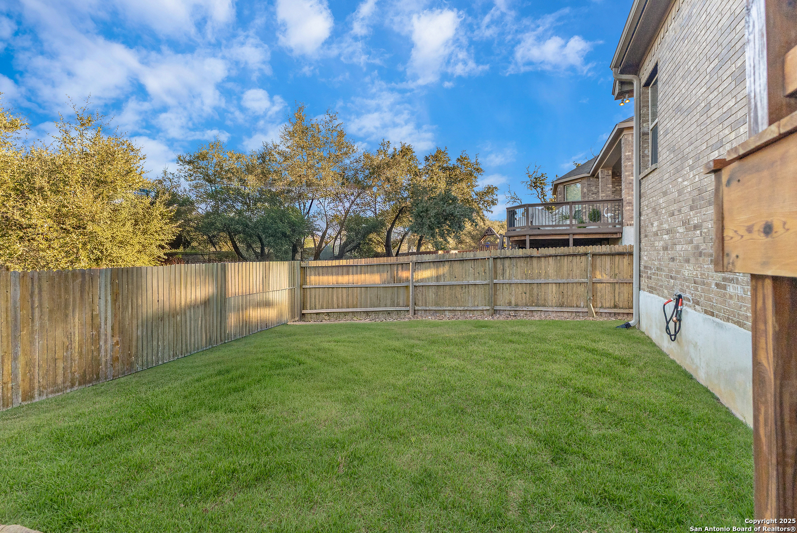 28938 Fairs Gate Fair Oaks Ranch, TX 78015 - Photo 38 of 41 a view of yard with house and trees in the background