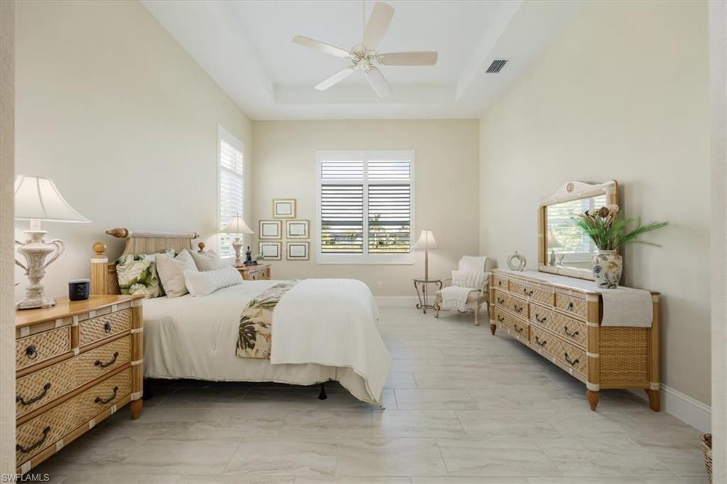 6152 Rodney Bay Lane Naples, FL 34113 - Photo 17 of 45 a bed room with bed and a window