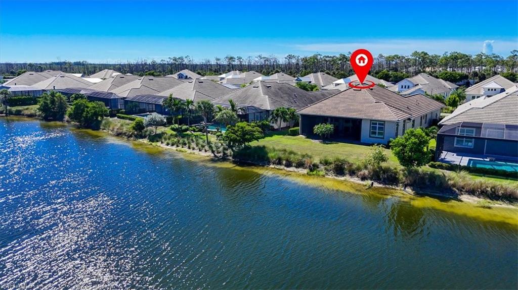 6152 Rodney Bay Lane Naples, FL 34113 - Photo 3 of 45 an aerial view of residential houses and lake view