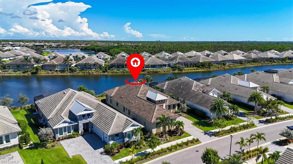6152 Rodney Bay Lane Naples, FL 34113 - Photo 33 of 45 an aerial view of a house with a garden and outdoor seating