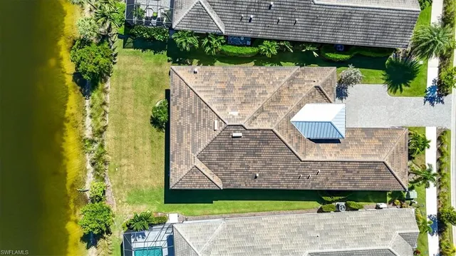 an aerial view of a house having yard