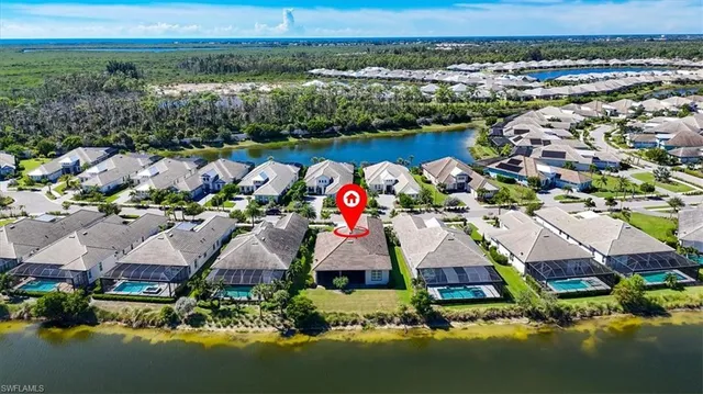 an aerial view of house swimming pool and lake view