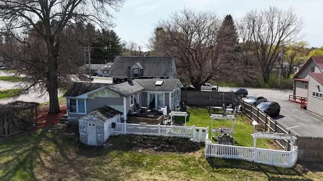 an aerial view of a house with outdoor space