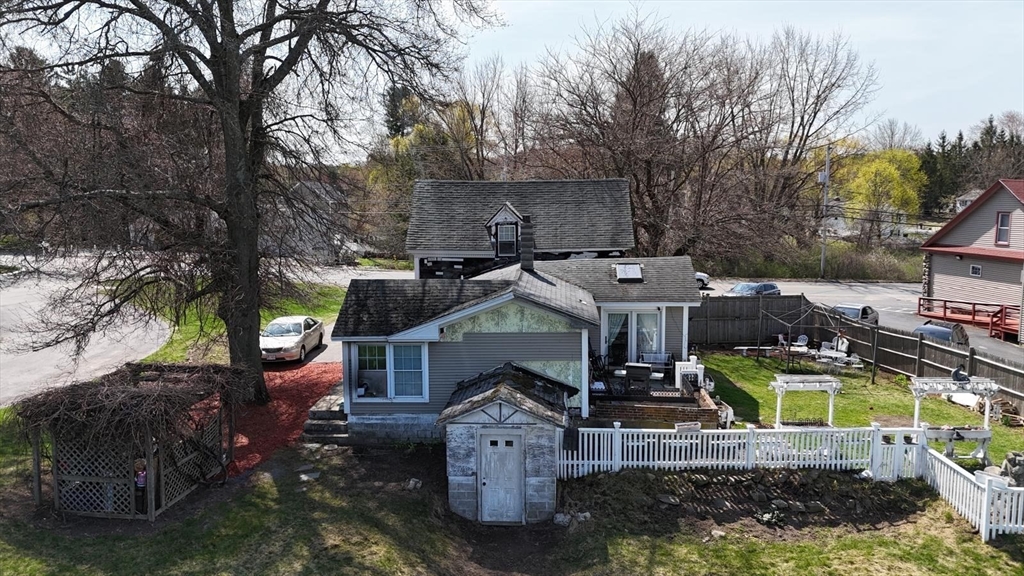 122 Pleasant Valley Street Methuen, MA 01844 - Photo 14 of 27 a view of a house with a yard and sitting area