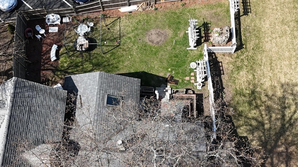 122 Pleasant Valley Street Methuen, MA 01844 - Photo 22 of 27 a backyard of a house with lots of green space and glass windows