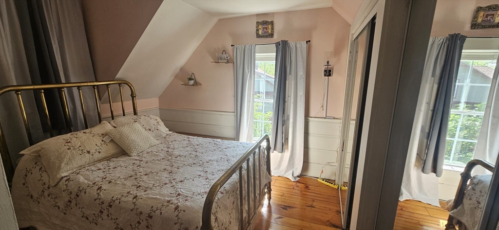 122 Pleasant Valley Street Methuen, MA 01844 - Photo 7 of 27 a living room with furniture and a fireplace