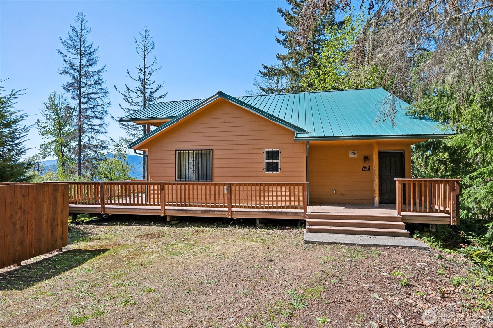 0 Boyd Road Randle, WA 98377 - Photo 24 of 39 a view of a house with a yard and wooden deck