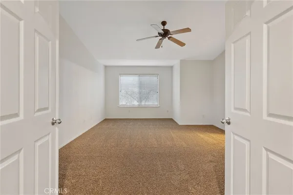 an empty room with a empty space and a window