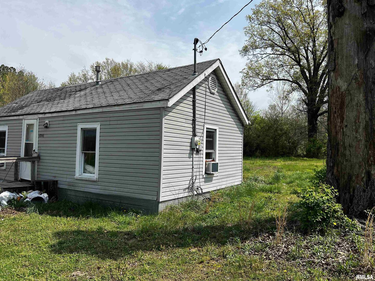 6846 East 1st Street Logan, IL 62856 - Photo 2 of 16 a view of a house with a yard
