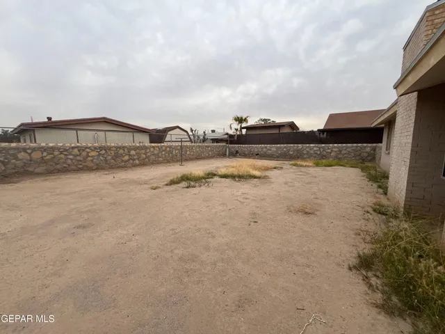 a view of a lake with houses in the back