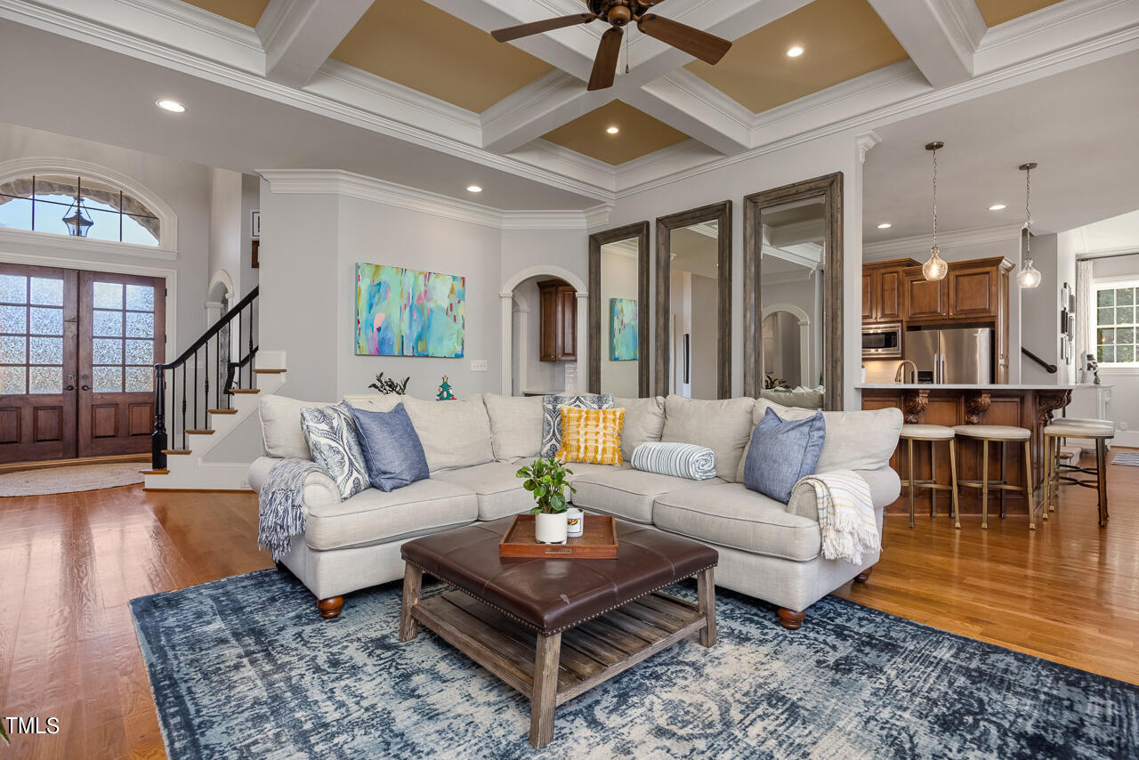 1204 High Glen Point Raleigh, NC 27614 - Photo 11 of 73 a living room with furniture a ceiling fan and a rug