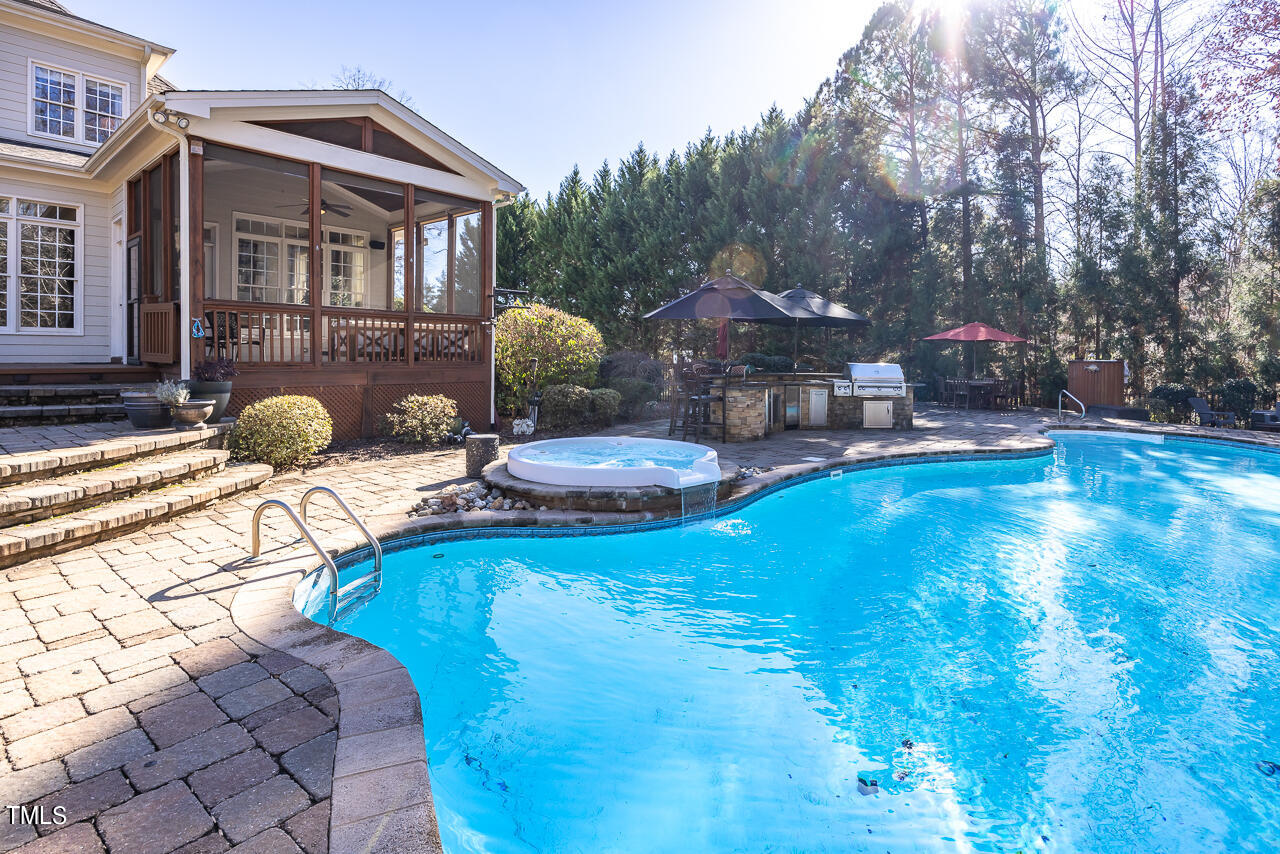 1204 High Glen Point Raleigh, NC 27614 - Photo 48 of 73 a backyard of a house with table and chairs