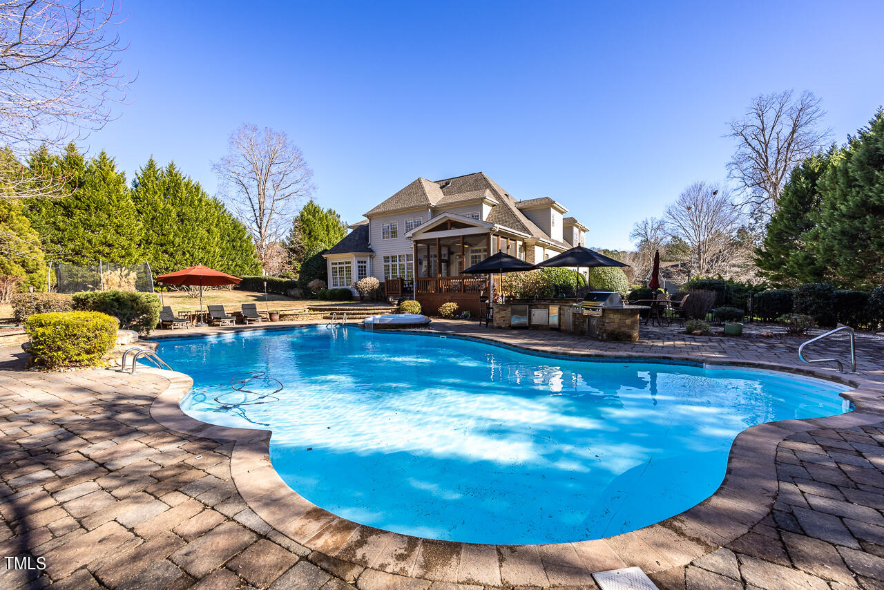 1204 High Glen Point Raleigh, NC 27614 - Photo 53 of 73 a view of a swimming pool with lounge chair