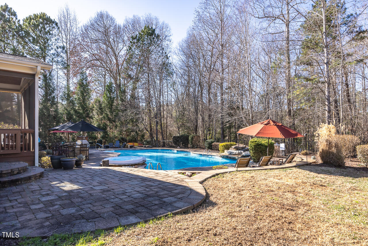 1204 High Glen Point Raleigh, NC 27614 - Photo 60 of 73 a view of a house with a yard patio and sitting area