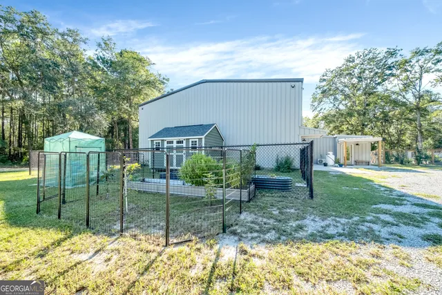 a view of a backyard with sitting area