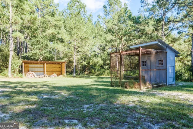 a backyard of a house with lots of green space and garden
