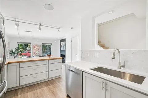 a kitchen with a sink and cabinets