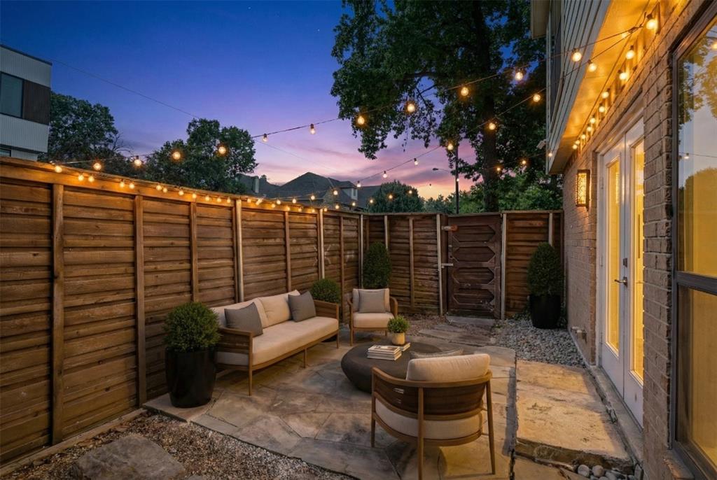 4102 Bowser Avenue, Unit 1 Dallas, TX 75219 - Photo 14 of 33 Spacious ground-level patio offers a secluded outdoor retreat for relaxing or entertaining