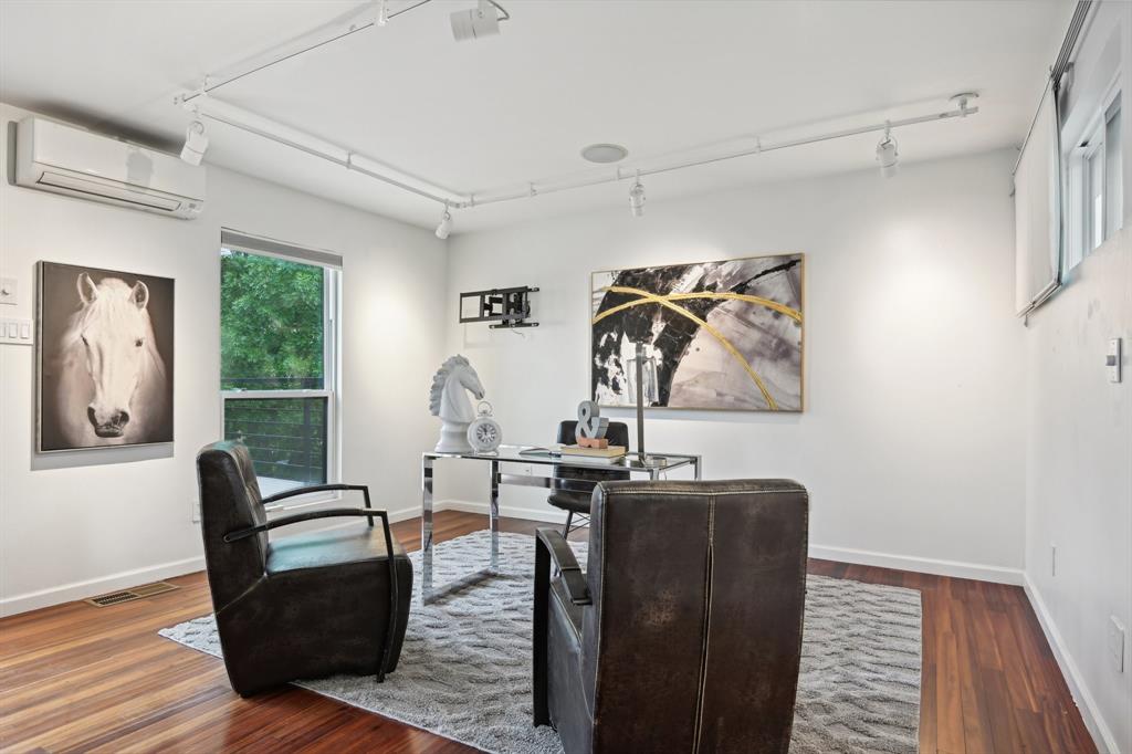 4102 Bowser Avenue, Unit 1 Dallas, TX 75219 - Photo 28 of 33 Versatile top-floor flex space with rich hardwood floors and access to the rooftop deck